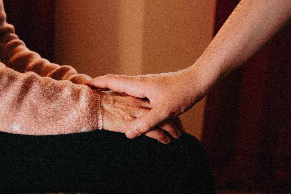 resting hands on top of someone elses hands